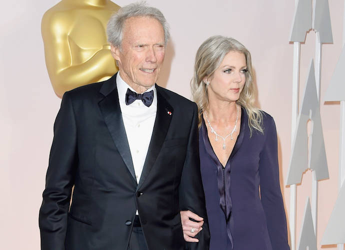 HOLLYWOOD, CA - FEBRUARY 22: Director Clint Eastwood (L) and Christina Sandera attend the 87th Annual Academy Awards at Hollywood & Highland Center on February 22, 2015 in Hollywood, California. (Image: Getty)