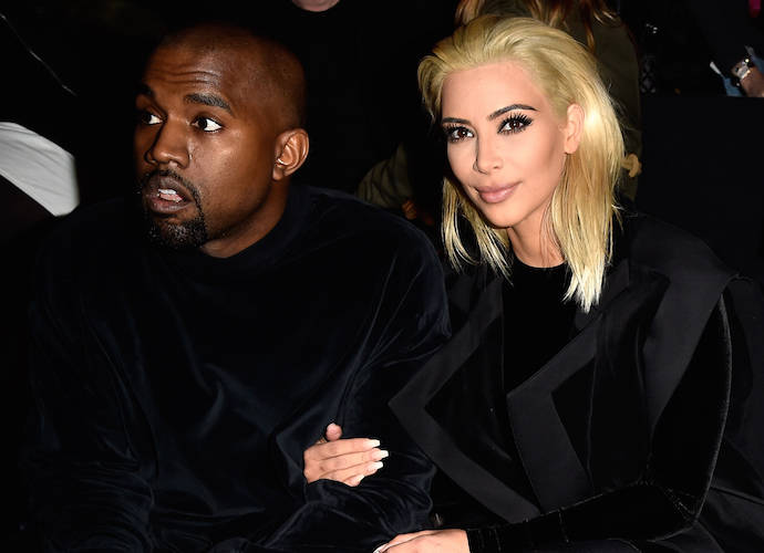 PARIS, FRANCE - MARCH 05: Kim Kardashian and Kanye West attend the Balmain show as part of the Paris Fashion Week Womenswear Fall/Winter 2015/2016 on March 5, 2015 in Paris, France. (Image: Getty)