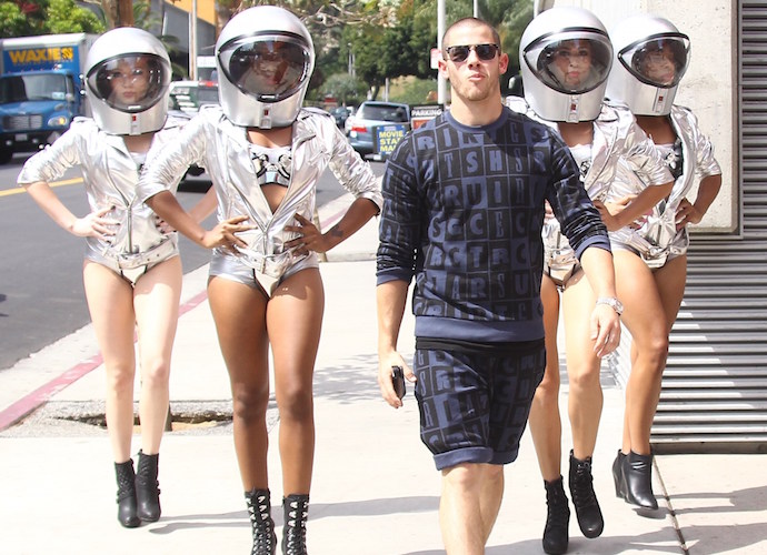 Nick Jonas films scenes for the MTV Video Music Awards followed by four space women in silver spacesuits Featuring: Nick Jonas Where: Los Angeles, United States When: 13 Aug 2015 Credit: WENN.com