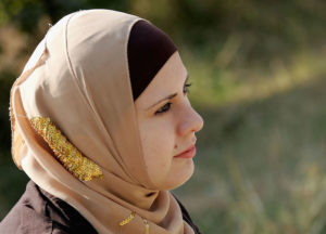 An Iraqi female student, wearing Islamic veil