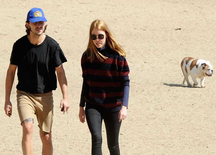 Newly weds Shia LaBeouf and Mia Goth out at a park with their bulldog Brando