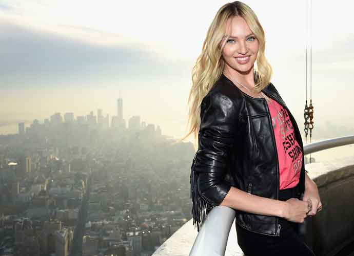 NEW YORK, NY - DECEMBER 07: Victoria's Secret Angel Candice Swanepoel Lights The Empire State Building In Pink Stripes on December 7, 2015 in New York City. (Photo by Dimitrios Kambouris/Getty Images for Victoria's Secret)