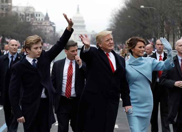 WASHINGTON, DC - JANUARY 20: U.S. President Donald Trump waves to supporters as he walks the parade route with first lady Melania Trump and son Barron Trump after being sworn in at the 58th Presidential Inauguration January 20, 2017 in Washington, D.C. Donald J. Trump was sworn in today as the 45th president of the United States (Photo by Evan Vucci - Pool/Getty Images)