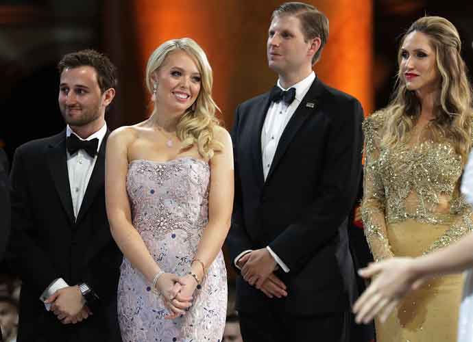 WASHINGTON, DC - JANUARY 20: (L-R) Tiffany Trump (2nd L) and her guest Ross Mechanic (L), and Eric Trump and his wife Lara Yunaska watch as U.S. President Donald Trump cuts a cake during the inaugural Armed Services Ball at the National Building Museum January 20, 2017 in Washington, DC. The ball is part of the celebrations following the inauguration of Trump. (Photo by Chip Somodevilla/Getty Images)