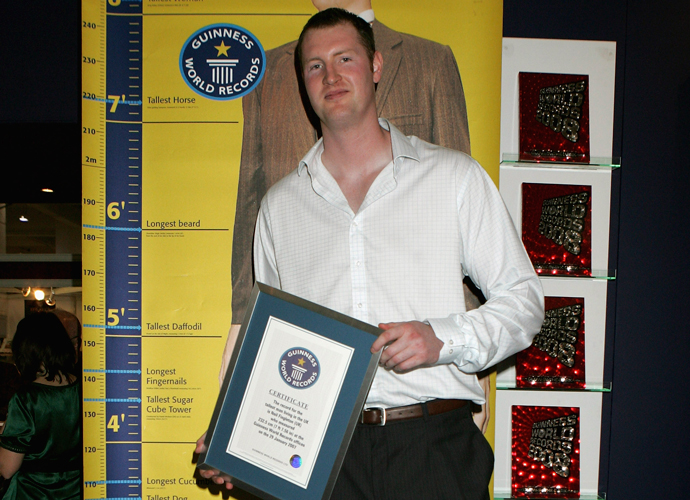 Neil Fingleton Dies: LONDON - APRIL 16: Neil Fingleton, Britain's tallest man is presented with the Guinness World Record for being Britains tallest man at The London Book Fair on April 16, 2007 in London, England. Fingleton is 232.5 cms high or 7ft 7.56 inches. (Photo by Chris Jackson/Getty Images)