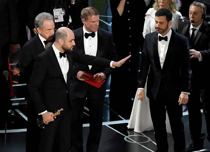 HOLLYWOOD, CA - FEBRUARY 26: 'La La Land' producer Jordan Horowitz (C) stops the show to announce the actual Best Picture winner as 'Moonlight' following a presentation error with actor Warren Beatty (L) and host Jimmy Kimmel (R) onstage during the 89th Annual Academy Awards at Hollywood & Highland Center on February 26, 2017 in Hollywood, California. (Photo by Kevin Winter/Getty Images)