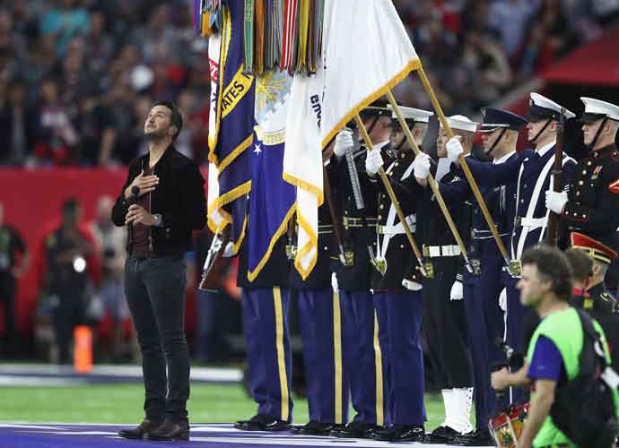 LUKE BRYAN PERFORMS NATIONAL ANTHEM AT SUPER BOWL LI: HOUSTON, TX - FEBRUARY 05: Country music singer and songwriter Luke Bryan performs the national anthem prior to Super Bowl 51 between the New England Patriots and the Atlanta Falcons at NRG Stadium on February 5, 2017 in Houston, Texas. (Photo by Tom Pennington/Getty Images)