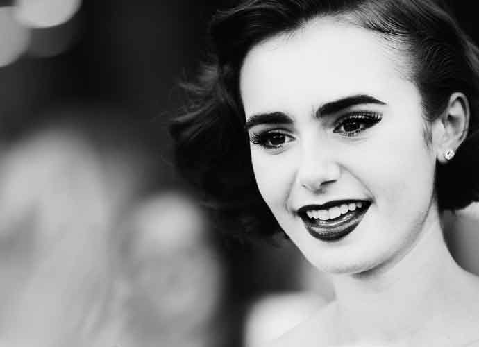ROME, ITALY - OCTOBER 19: (EDITORS NOTE: Image has been converted to black and white.) Lily Collins attends the 'Love, Rosie' Red Carpet during the 9th Rome Film Festival on October 19, 2014 in Rome, Italy. (Photo by Vittorio Zunino Celotto/Getty Images)