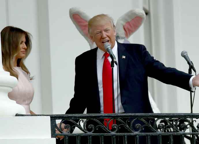 WASHINGTON, DC - APRIL 17: U.S. first lady Melania Trump (C) delivers remarks from the Truman Balcony with President Donald Trump and their son Barron Trump (L) during the 139th Easter Egg Roll on the South Lawn of the White House April 17, 2017 in Washington, DC. The White House said 21,000 people are expected to attend the annual tradition of rolling colored eggs down the White House lawn that was started by President Rutherford B. Hayes in 1878. (Photo by Chip Somodevilla/Getty Images)