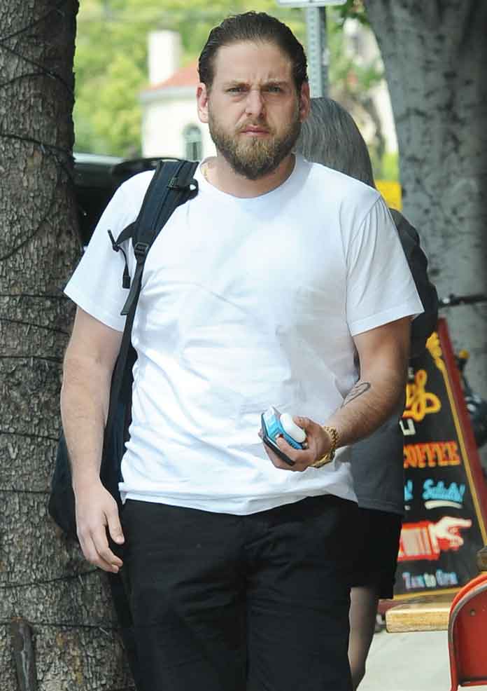 A slimmed down Jonah Hill out and about with a female friend