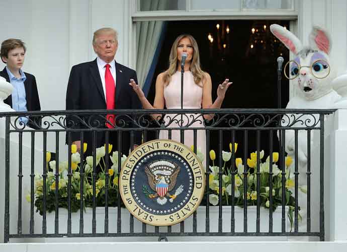 WASHINGTON, DC - APRIL 17: U.S. President Donald Trump (C) delivers remarks from the Truman Balcony with first lady Melania Trump and their son Barron Trump (L) during the 139th Easter Egg Roll on the South Lawn of the White House April 17, 2017 in Washington, DC. The White House said 21,000 people are expected to attend the annual tradition of rolling colored eggs down the White House lawn that was started by President Rutherford B. Hayes in 1878. (Photo by Chip Somodevilla/Getty Images)