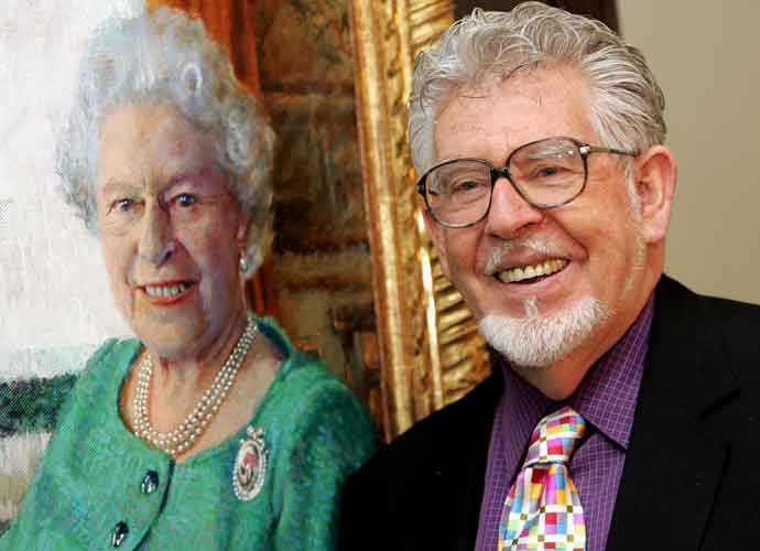 LONDON - DECEMBER 19: Artist Rolf Harris officially unveils his oil portrait of Queen Elizabeth II at The Queen's Gallery in Buckingham Palace on December 19, 2005 in London, England. Harris was permitted two sittings at Buckingham Palace, which were recorded for a BBC One documentary. More than 120 official portraits have been made of the Queen, by artists ranging from Dame Laura Knight to Lucien Freud. (Photo by Chris Jackson/Getty Images)