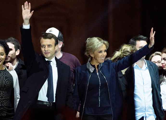 PARIS, FRANCE - MAY 07: Leader of 'En Marche !' Emmanuel Macron waves to supporters with wife Brigitte (C-R) after winning the French Presidential Election, at The Louvre on May 7, 2017 in Paris, France. Pro-EU centrist Macron is the next president of France after defeating far right rival Marine Le Pen by a comfortable margin, estimates indicate. (Photo by David Ramos/Getty Images)