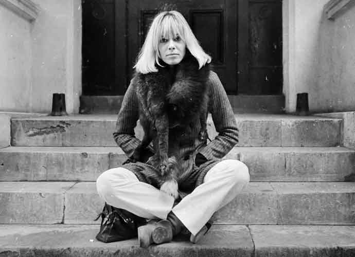 24th October 1968: Italian-born German actress Anita Pallenberg sits cross-legged on a flight of stone steps with her hands in her pockets. (Photo by Larry Ellis/Express/Getty Images)