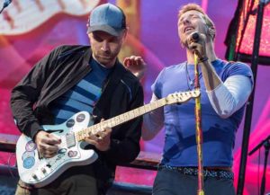 Coldplay performing live onstage at the Ullevi Stadium in Gothenburg, Sweden, where they played to an audience of 65,000 fans as part of their A Head Full of Dreams Tour: Chris Martin & Guitarist Johnny Buckland Perform (Image: Getty)