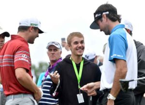 CHARLOTTE, NC - AUGUST 08: Musician Justin Bieber speaks to Wesley Bryan and Bubba Watson of the United States during a practice round prior to the 2017 PGA Championship at Quail Hollow Club on August 8, 2017 in Charlotte, North Carolina. (Photo by Stuart Franklin/Getty Images)