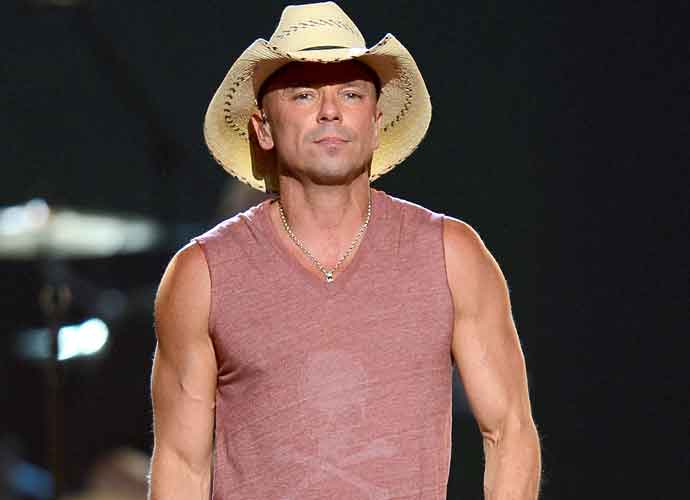 LAS VEGAS, NV - APRIL 07: Singer Kenny Chesney performs onstage during the 48th Annual Academy of Country Music Awards at the MGM Grand Garden Arena on April 7, 2013 in Las Vegas, Nevada. (Photo by Ethan Miller/Getty Images)
