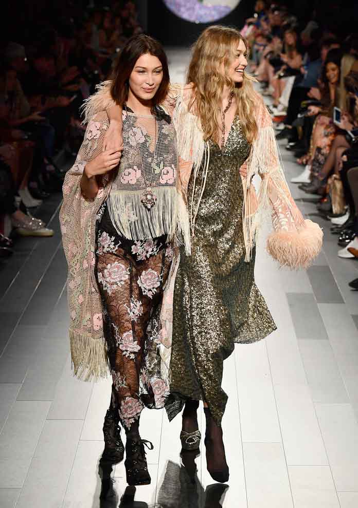Models Bella Haddid and Gigi Hadid walk the runway for Anna Sui fashion show during New York Fashion Week: The Shows at Gallery 1, Skylight Clarkson Sq on September 11, 2017 in New York City. (Photo by Frazer Harrison/Getty Images For NYFW: The Shows)