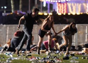 LAS VEGAS, NV - OCTOBER 01: People run from the Route 91 Harvest country music festival after apparent gun fire was hear on October 1, 2017 in Las Vegas, Nevada. A gunman has opened fire on a music festival in Las Vegas, leaving at least 20 people dead and more than 100 injured. Police have confirmed that one suspect has been shot. The investigation is ongoing. (Photo by David Becker/Getty Images)