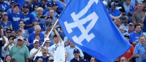 Actor and comedian Ken Jeong waves a Los Angeles Dodgers flag before game one of the 2017 World Series between the Houston Astros and the Los Angeles Dodgers at Dodger Stadium on October 24, 2017 in Los Angeles, California.