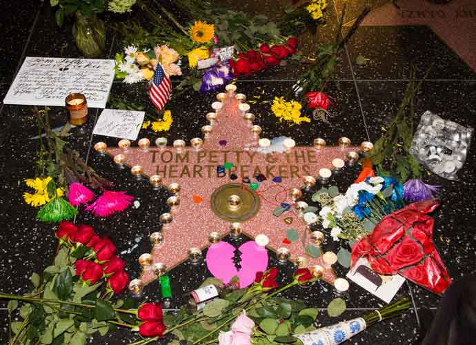 Fans gather to mourn the death of Tom Petty at his star on the Hollywood Walk of Fame in Los Angeles, California, after it had been announced that the musician had died at the age of 66.