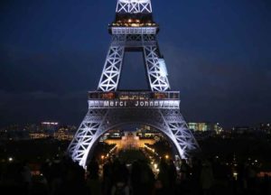 The words, 'Merci Johnny' in tribute to late French singer Johnny Hallyday are seen on the Eiffel Tower in Paris, France