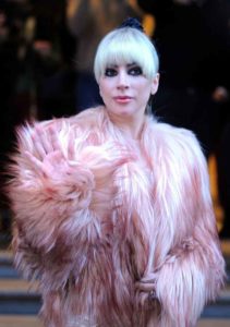 Lady Gaga leaving her hotel in Milan wearing a pink fur coat