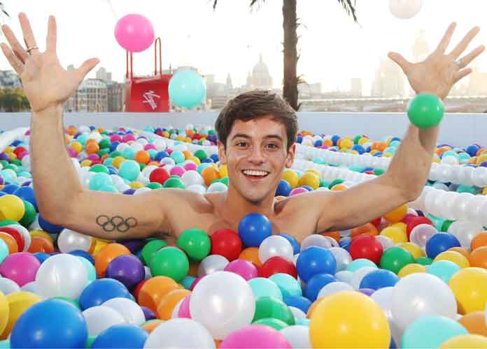 British diver Tom Daley jumps into ball pool