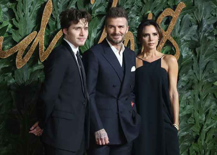 David Beckham, Victoria Beckham, and Brooklyn Beckham attend The British Fashion Awards 2018 held at the Royal Albert Hall