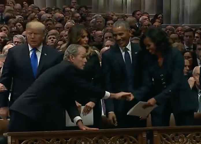 George W. Bush gives Michelle Obama candy at George H.W. Bush's funeral
