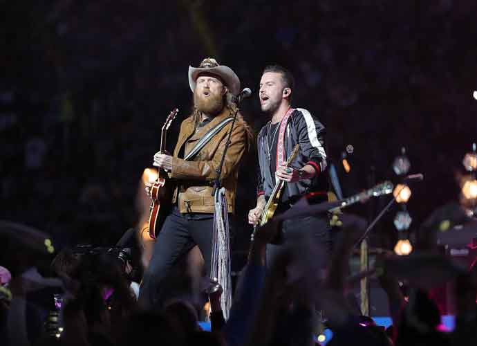 DETROIT, MI - NOVEMBER 28: John Osborne (L) and T.J. Osborne (R) of the Brothers Osborne perform during the half time of the game between the Chicago Bears and the Chicago Bears show at Ford Field on November 28, 2019 in Detroit, Michigan.