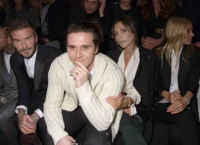 David, Victoria & Brooklyn Beckham Sit Front Row At Dior Homme Show