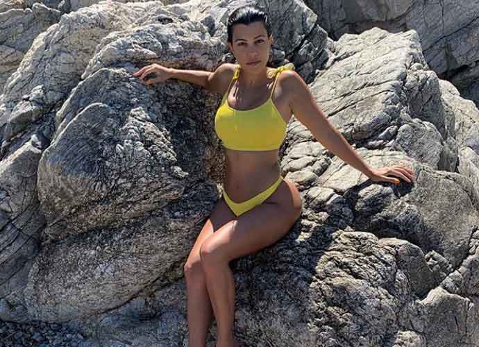 Kourtney Kardashian Dazzles In Tiny Yellow Bikini In Sardinia