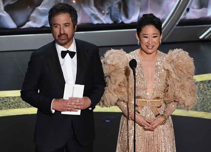 HOLLYWOOD, CALIFORNIA - FEBRUARY 09: (L-R) Ray Romano and Sandra Oh speak onstage during the 92nd Annual Academy Awards at Dolby Theatre on February 09, 2020 in Hollywood, California