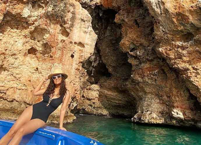 Salma Hayek Chills In A Black Swimsuit On Vacation