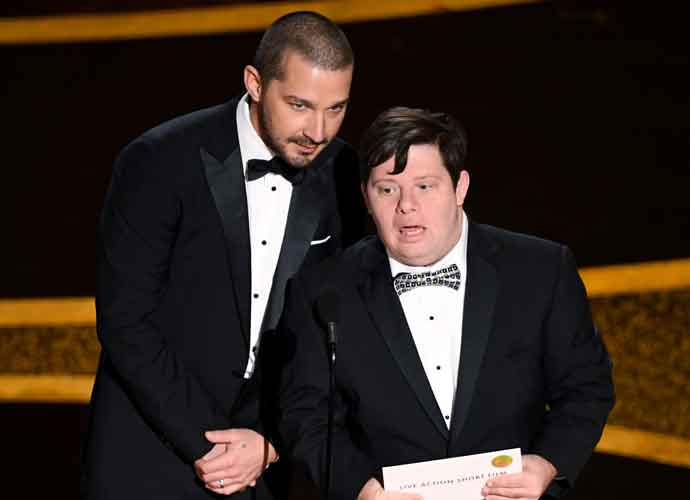 HOLLYWOOD, CALIFORNIA - FEBRUARY 09: (L-R) Shia LaBeouf and Zack Gottsagen speak onstage during the 92nd Annual Academy Awards at Dolby Theatre on February 09, 2020 in Hollywood, California.