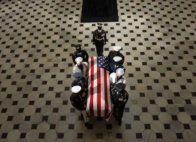 WASHINGTON, DC - SEPTEMBER 25: A U.S. military carry team moves U.S. Supreme Court Associate Justice Ruth Bader Ginsburg's flag-draped casket out of Statuary Hall after she layed in state at the U.S. Capitol on September 25, 2020 in Washington, DC. Ginsburg, who was appointed by former U.S. President Bill Clinton, served on the high court from 1993 until her death on September 18, 2020. She is the first woman to lie in state at the Capitol