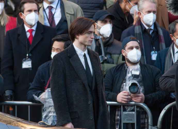 LIVERPOOL, ENGLAND - OCTOBER 13: British actor Robert Pattinson pictured during filming of The Batman movie which is taking place outside St. George's Hall, on October 13, 2020 in Liverpool, England. The Batman is an upcoming American superhero film based on the DC Comics character of the same name. Produced by DC Films and distributed by Warner Bros. Pictures, it is a reboot of the Batman film franchise directed by Matt Reeves. (Image: Getty)