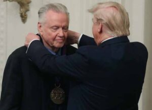 WASHINGTON, DC - NOVEMBER 21: U.S. President Donald Trump (R) presents actor Jon Voight with the National Medal of Arts during a ceremony in the East Room of the Whit House on November 21, 2019 in Washington, DC.