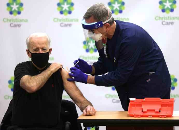 WILMINGTON, DELAWARE - JANUARY 11: President-elect Joe Biden (L) receives the second dose of a COVID-19 Vaccination from Chief Nurse Executive Ric Cuming (R) at ChristianaCare Christiana Hospital on January 11, 2021 in Newark, Delaware. Biden received the second dose of the Pfizer/BioNTech coronavirus vaccine, three weeks after the first dose he had received a few days before Christmas in 2020.. (Photo by Alex Wong/Getty Images)