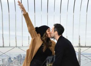 NEW YORK, NEW YORK - FEBRUARY 12: Tayshia Adams and Zac Clark celebrate their love at The Empire State Building on February 12, 2021 in New York City. (Photo by Dimitrios Kambouris/Getty Images for Empire State Realty Trust)