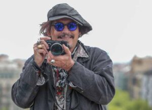BARCELONA, SPAIN - APRIL 16: Actor Johnny Depp takes some pictures with his Olympus camera while attends a photocall to present his latest movie ‘Minamata’ during 5th BCN Film Festival's at Casa Fuster Hotelon April 16, 2021 in Barcelona, Spain. (Photo by Miquel Benitez/Getty Images)