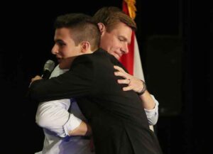SUNRISE, FLORIDA - APRIL 09: Rep. Eric Swalwell (D-CA) (R), who announced that he is running for president in 2020, hugs Cameron Kasky, who survived the shooting at Marjory Stoneman Douglas High School, during a gun violence town hall at the BB&T Center on April 09, 2019 in Sunrise, Florida. Rep. Swalwell held the town hall not far from Marjory Stoneman Douglas high school which was the site of a mass shooting in 2018. (Photo by Joe Raedle/Getty Images)