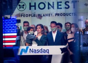 Jessica Alba, co-founder and chief creative officer of Honest Co., right, poses for photographs outside the Nasdaq MarketSite during the opening bell during the company's initial public offering (IPO) with Nick Vlahos, chief executive officer of Honest Co., second right, in New York, U.S., on Wednesday, May 5, 2021. Actress Jessica Alba cemented her claim to one of the most lucrative side gigs in Hollywood after shares of her beauty business, the Honest Co., priced its initial public offering at $16, within its marketed range. Photographer: Michael Nagle/Bloomberg via Getty Images