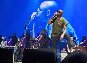 NEW YORK, NEW YORK - JUNE 20: Dave Chappelle performs "Creep" onstage with The Foo Fighters as they reopen Madison Square Garden on June 20, 2021 in New York City. The concert, with all attendees vaccinated, is the first in a New York arena to be held at full-capacity since March 2020 when the pandemic lead to the closure of live performance venues. (Photo by Kevin Mazur/Getty Images for FF)