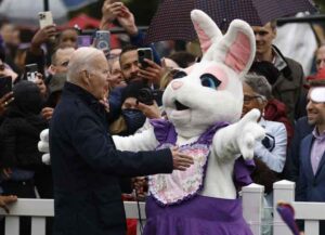 U.S. President Joe Biden and a performer dressed as the Easter Bunny during the Easter Egg Roll on the South Lawn of the White House in Washington, D.C., U.S., on Monday, April 18, 2022. First Lady Jill Biden, a teacher for more than 30 years, created this year's event theme of EGGucation! Photographer: Ting Shen/Bloomberg via Getty Images