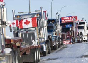 Lines of trucks block the U.S.-Canada border during a demonstration in Coutts, Alberta, Canada, on Wednesday, Feb. 2, 2022. Since Saturday, a blockade of some 100 trucks has been in place on the north side of the crossing between Alberta and Montana to protest vaccination mandates put in place this month for truck drivers going across the Canada-U.S. border, the Toronto Star reports. Photographer: Gavin John/Bloomberg via Getty Images