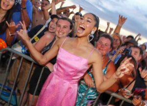 WAIKIKI, HI - SEPTEMBER 19: Meaghan Rath poses for a photo with fans before the Sunset On The Beach event celebrating the 10th season of "Hawaii Five-0" and season 2 of "Magnum P.I." at Queen's Surf Beach on September 19, 2019 in Waikiki, Hawaii. (Photo by Darryl Oumi/Getty Images)