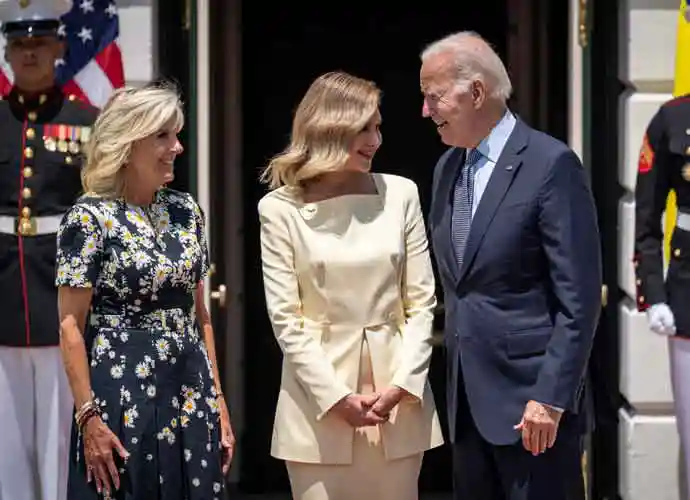 WASHINGTON, DC - JULY 19: (L-R) U.S. first lady Jill Biden, first lady of Ukraine Olena Zelenska and U.S. President Joe Biden pose for photos as Zelenska arrives on the South Lawn of the White House July 19, 2022 in Washington, DC. Zelenska is in the United States for a series of high-level meetings and an address to Congress. (Photo by Drew Angerer/Getty Images)