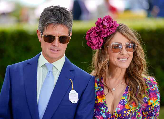 CHICHESTER, ENGLAND - JULY 27: Actress Liz Hurley with friend Henry Birtles during day two of the Qatar Goodwood Festival at Goodwood Racecourse on July 27, 2022 in Chichester, England. (Photo by Alan Crowhurst/Getty Images)